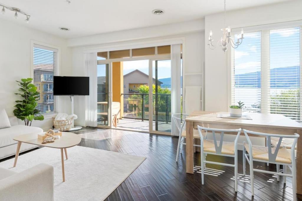a living room with a table and a dining room at The Beach House at Barona Beach 4301 in West Kelowna