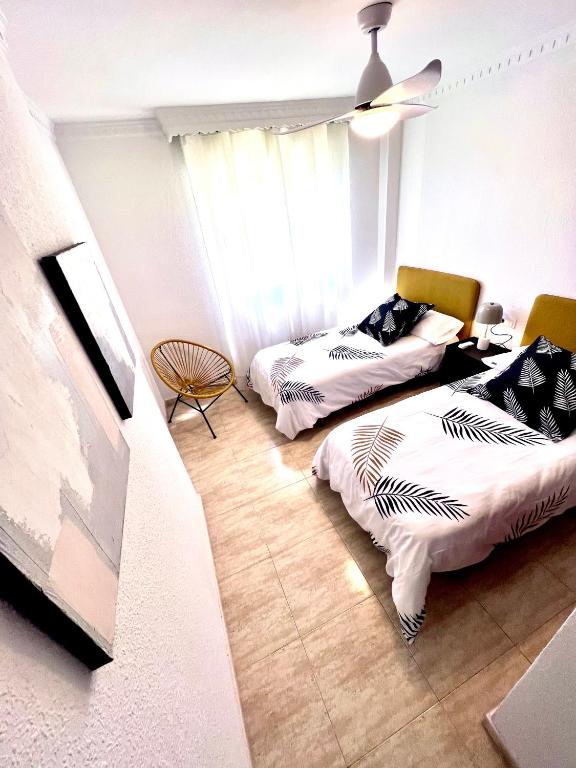 Posteľ alebo postele v izbe v ubytovaní Ketan Suite Nadales