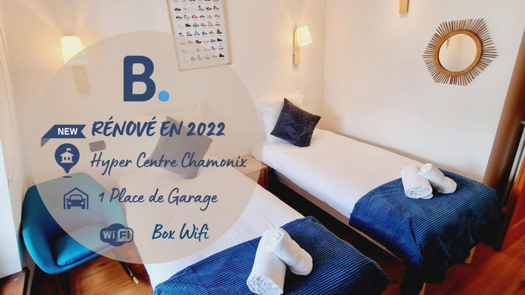 dwa łóżka w pokoju ze znakiem, na którym widnieje napis: nowe doradztwo w zakresie wymiany przychodów w obiekcie ALPES IV - Hyper Centre - Parking - 40m² w Chamonix-Mont-Blanc