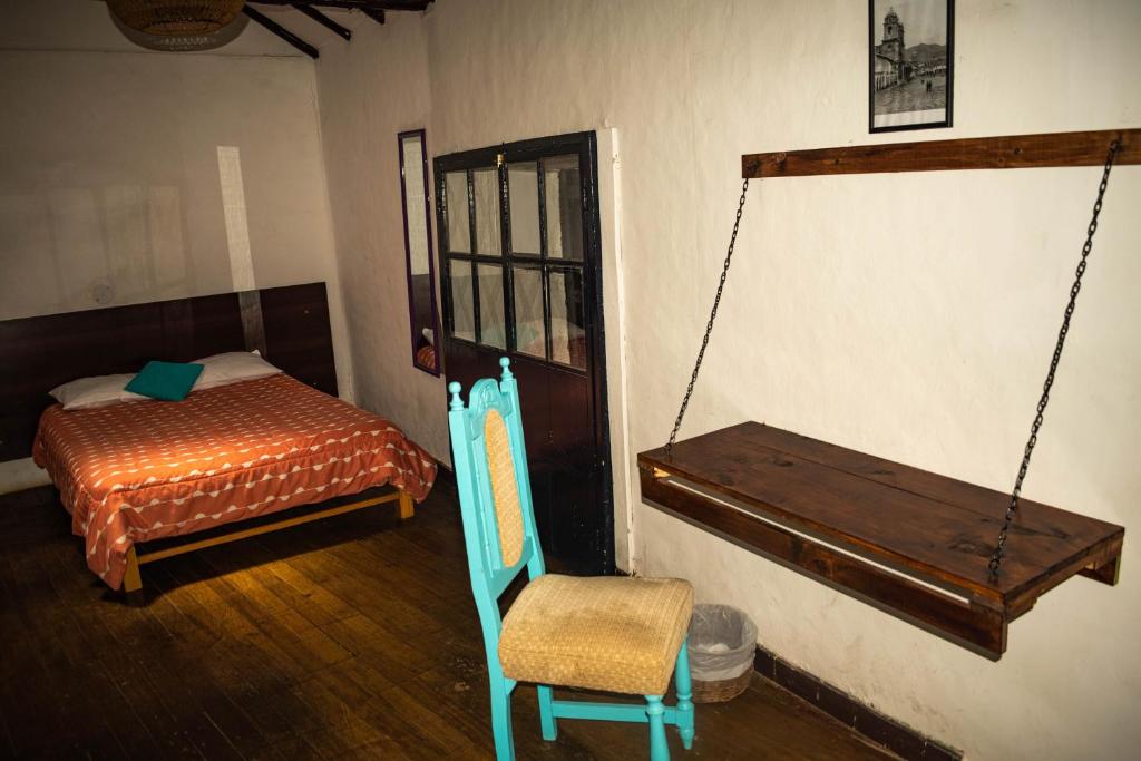 Letto o letti in una camera di Intro Hostels Cusco