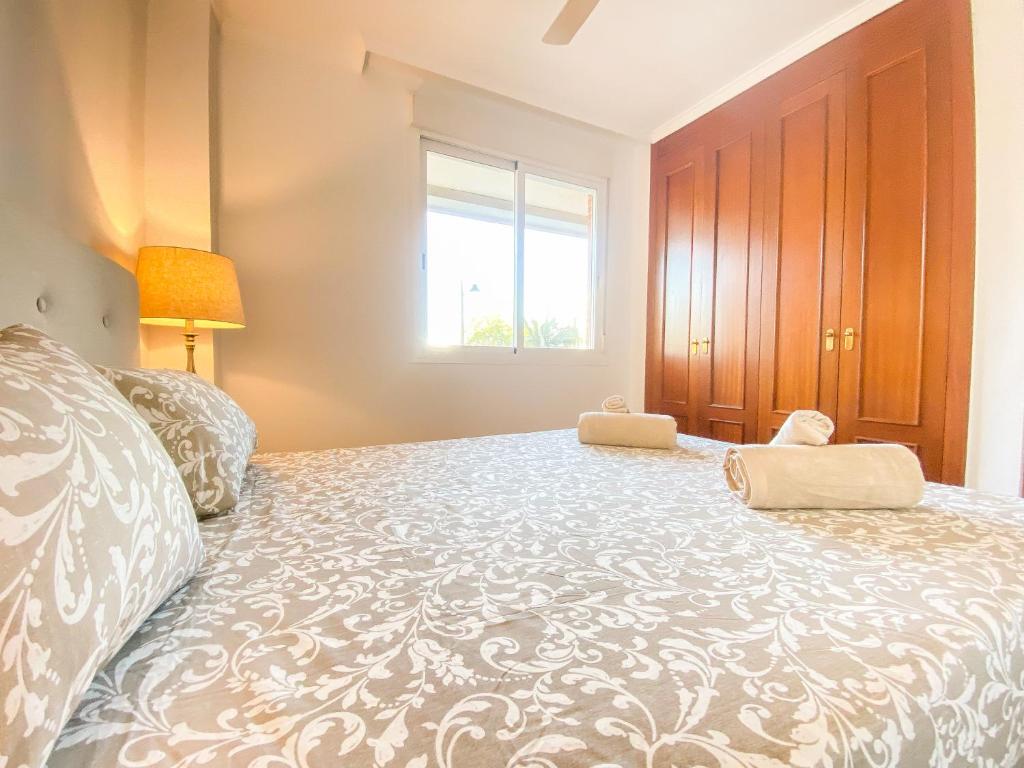 A bed or beds in a room at Great Location, Estepona Town