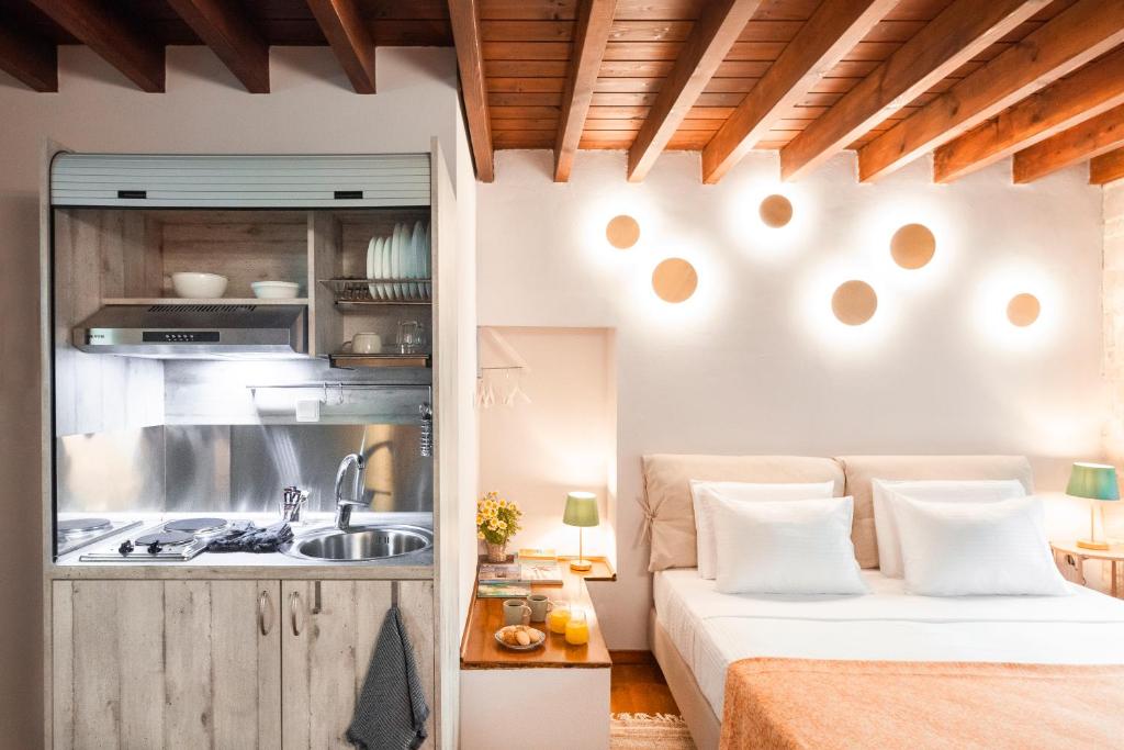 Postel nebo postele na pokoji v ubytování Mandorla Apartments