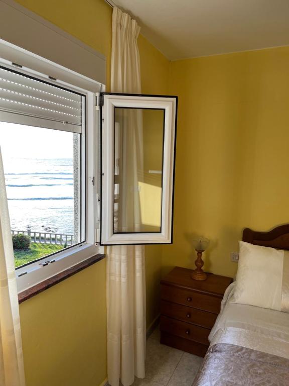 Posteľ alebo postele v izbe v ubytovaní Apartamento Playa de Lires