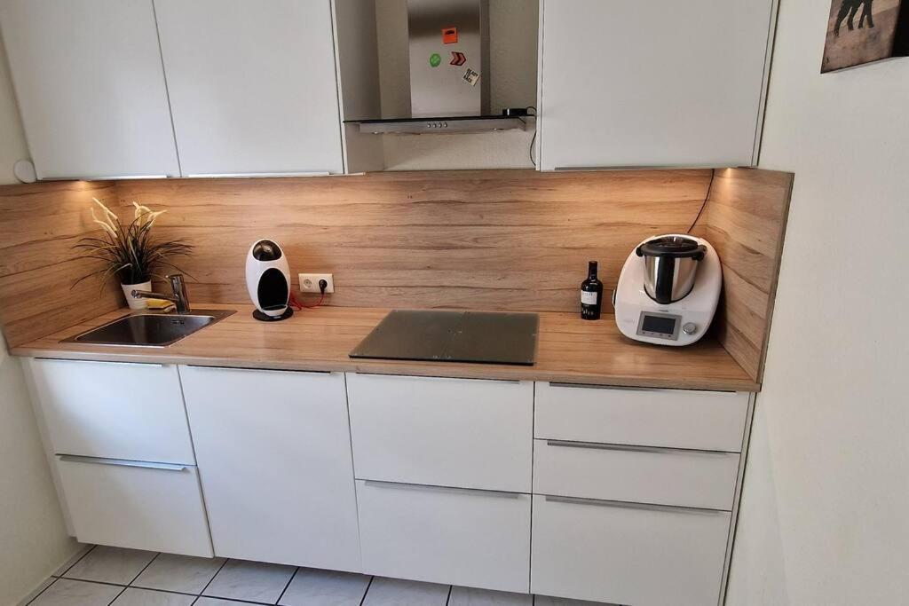 a kitchen with a counter top with a laptop on it at Ferienwohnung in zentraler Lage und Kurparknähe in Bad Lauterberg