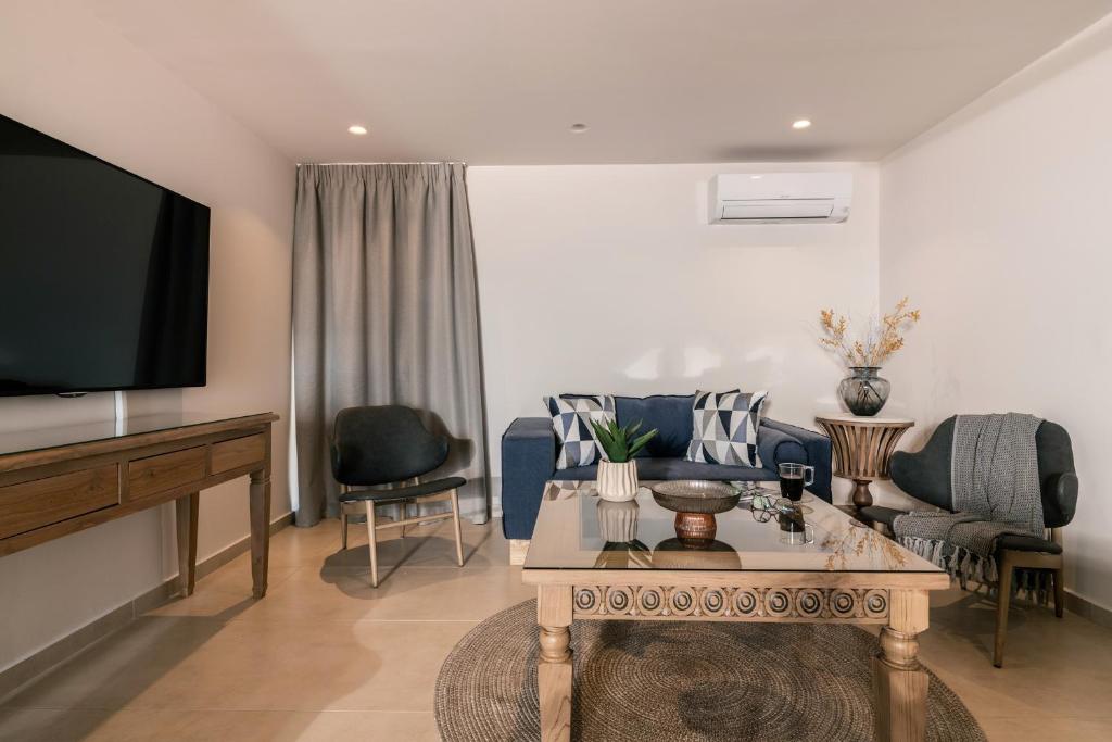 Televízia a/alebo spoločenská miestnosť v ubytovaní Phoenix Apartments