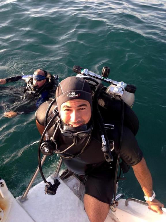 two people on a boat in the water at Arab Divers Dive Center and Bed & Breakfast in Aqaba