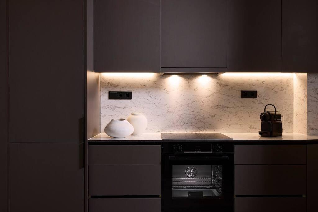 A kitchen or kitchenette at Acropolis Museum Grand Residence