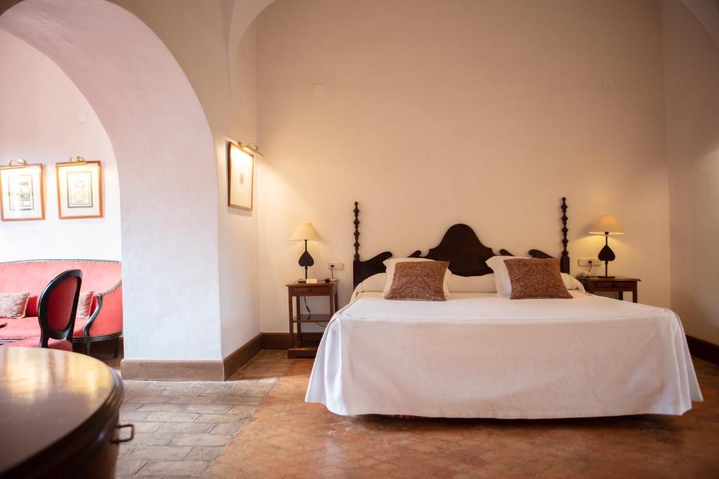 Postel nebo postele na pokoji v ubytování Monasterio de San Francisco