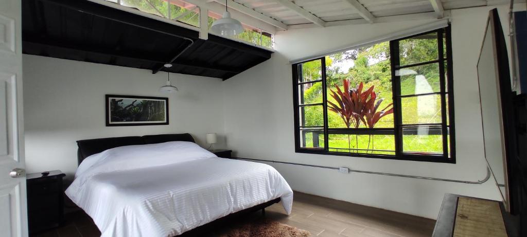 A bed or beds in a room at INLOFT Quindío