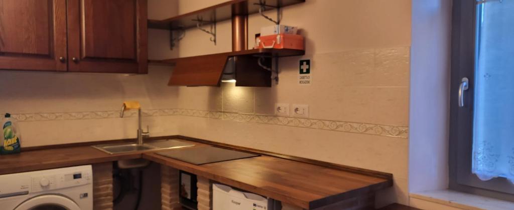 Kuchyň nebo kuchyňský kout v ubytování Apartment Nonna Delia