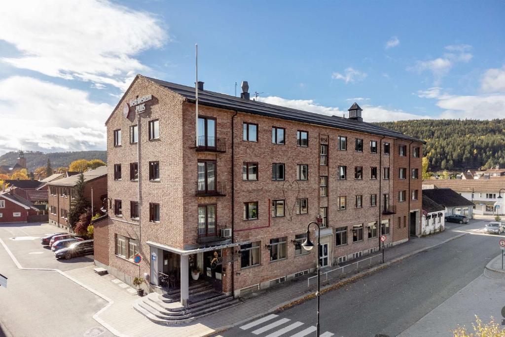 a large brick building on the side of a street at Best Western Plus Gyldenlove Hotell in Kongsberg