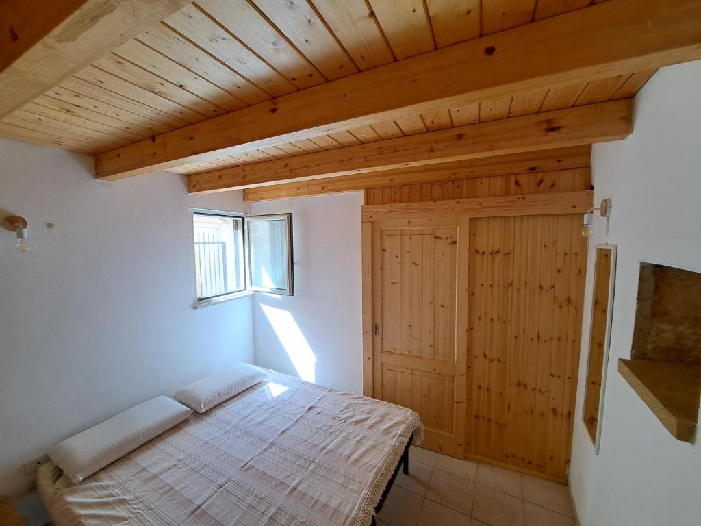 Postel nebo postele na pokoji v ubytování Corte Giuggiola