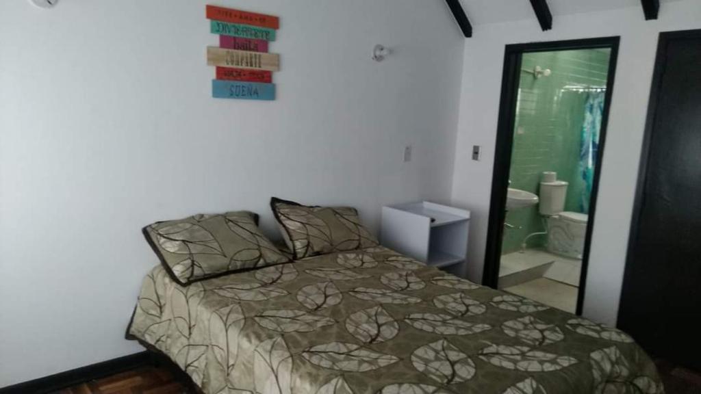 Postel nebo postele na pokoji v ubytování Hotel Bogotá Calle 100