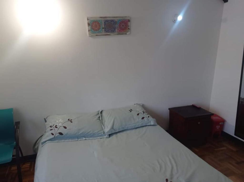 Postel nebo postele na pokoji v ubytování Hotel Bogotá Calle 100