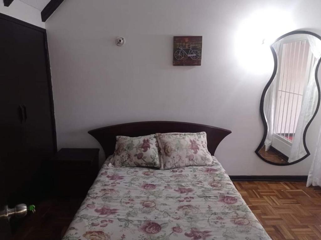 Postel nebo postele na pokoji v ubytování Hotel Bogotá Calle 100