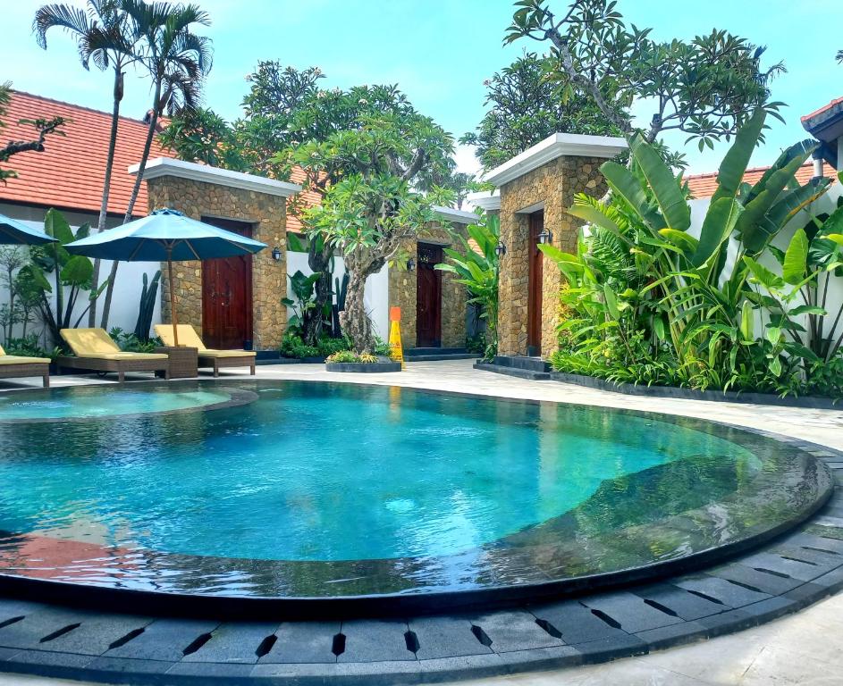 a swimming pool in the middle of a house at Alam Jepun Villa in Legian