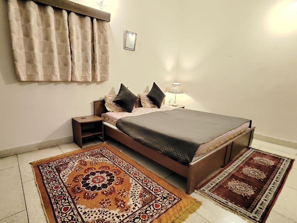 Postel nebo postele na pokoji v ubytování UVs Homestay