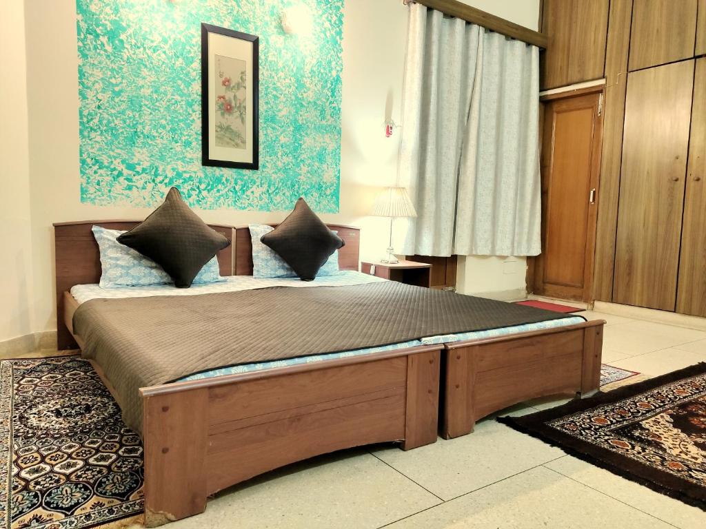 Postel nebo postele na pokoji v ubytování UVs Homestay