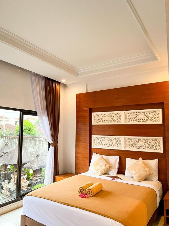 Postel nebo postele na pokoji v ubytování The Donno ubud Guest house