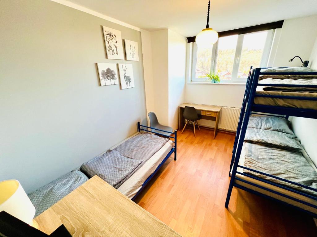 Postel nebo postele na pokoji v ubytování Hostel Pod Gromadzyniem