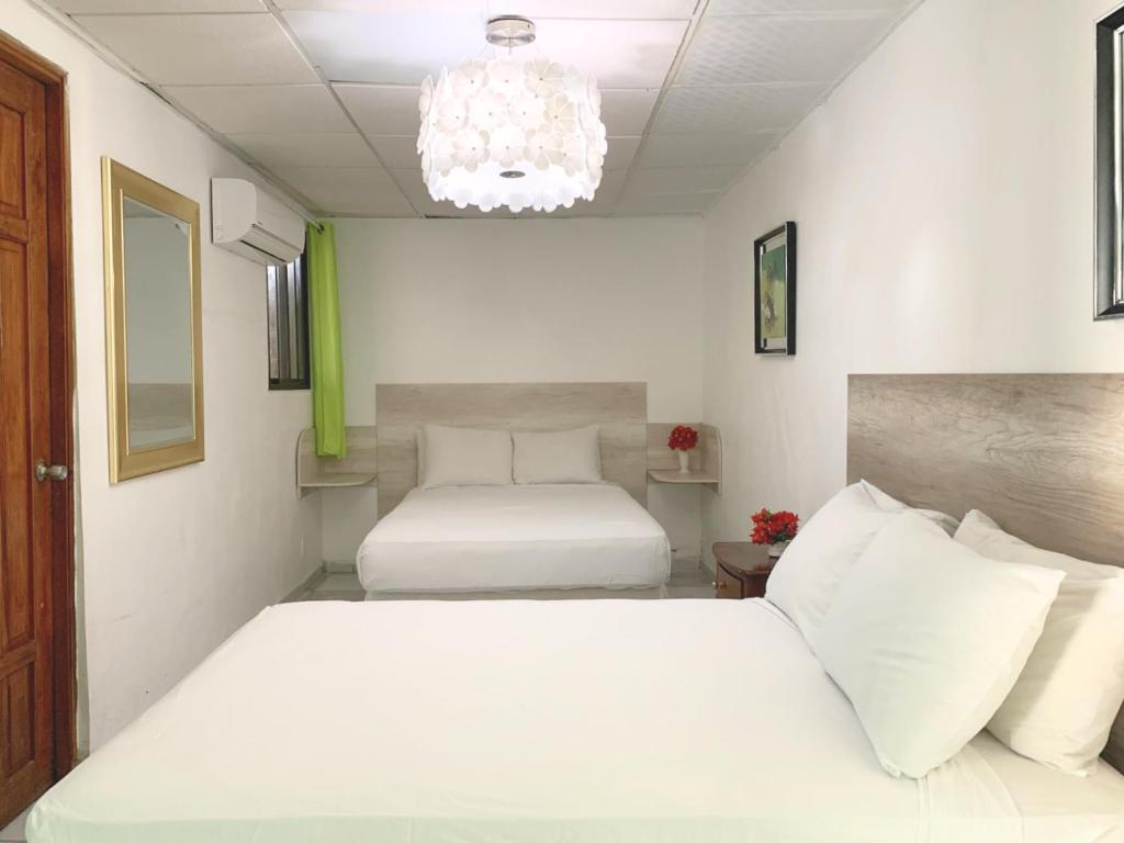 Pacific Coast Hotel - Chambre Quadruple Avec Salle De Bain Privée