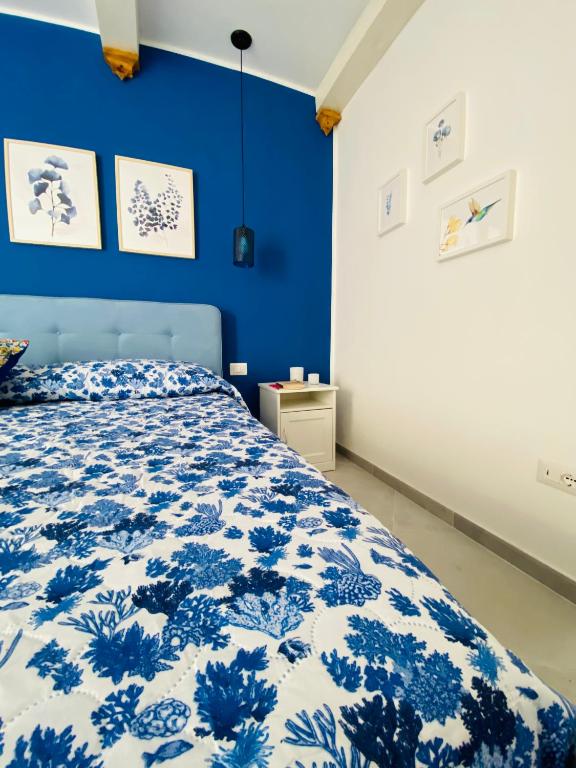 Postel nebo postele na pokoji v ubytování Casa 68 Ortigia