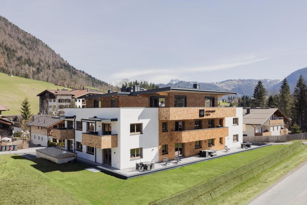 an aerial view of a house with mountains in the background at Apartment Streif LXL in Kirchdorf in Tirol