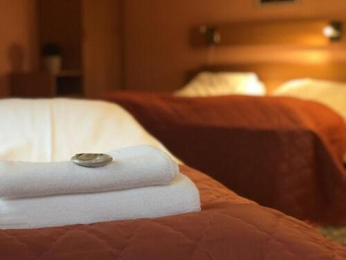 Postel nebo postele na pokoji v ubytování Grong Hotell