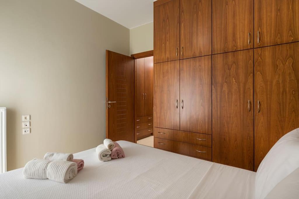 A bed or beds in a room at Charilena's luxury apartment