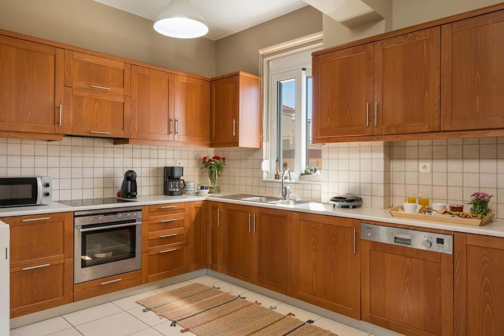 A kitchen or kitchenette at Charilena's luxury apartment