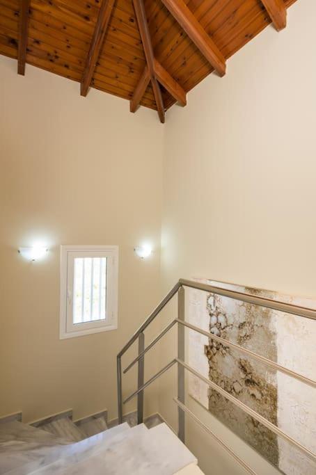 A bed or beds in a room at Charilena's luxury apartment
