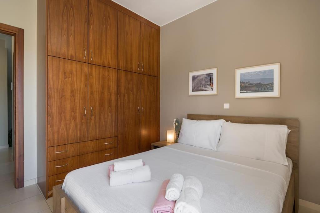 A bed or beds in a room at Charilena's luxury apartment