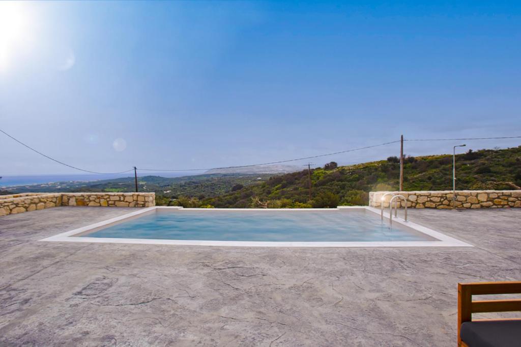 a swimming pool with a view of a mountain at Villa Fortuna in Chania