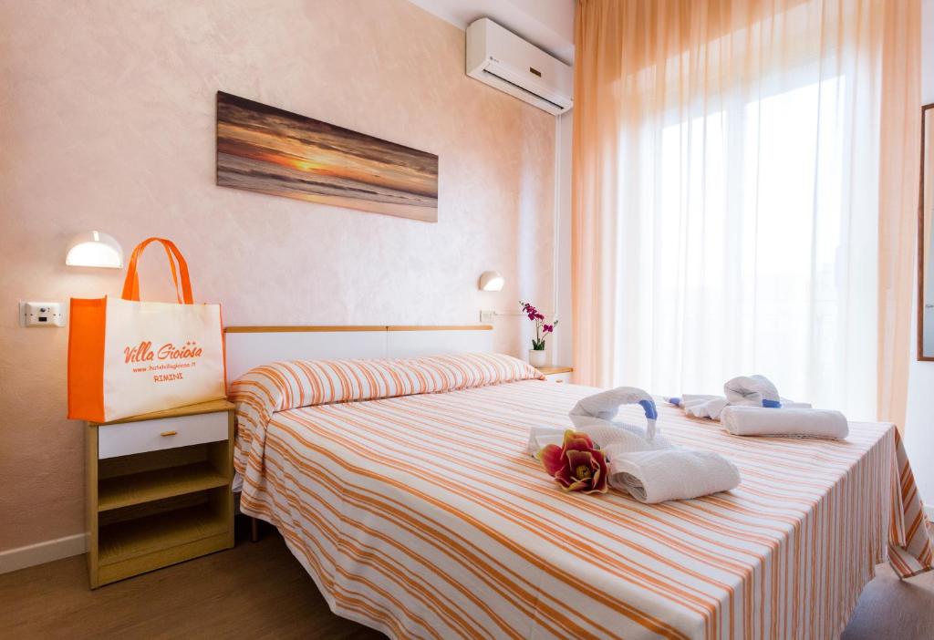 Postel nebo postele na pokoji v ubytování Hotel Villa Gioiosa