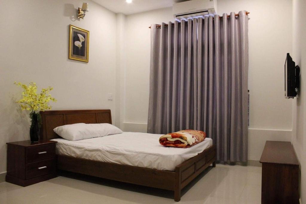 Postel nebo postele na pokoji v ubytování Motel Minh Thảo