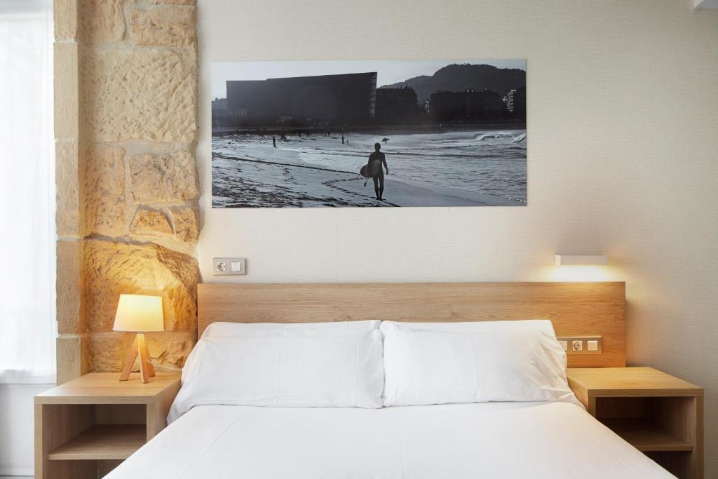 Postel nebo postele na pokoji v ubytování Welcome Gros Hotel