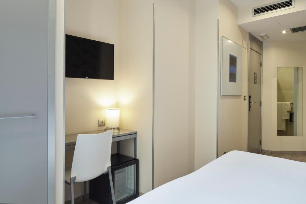 Postel nebo postele na pokoji v ubytování Welcome Gros Hotel