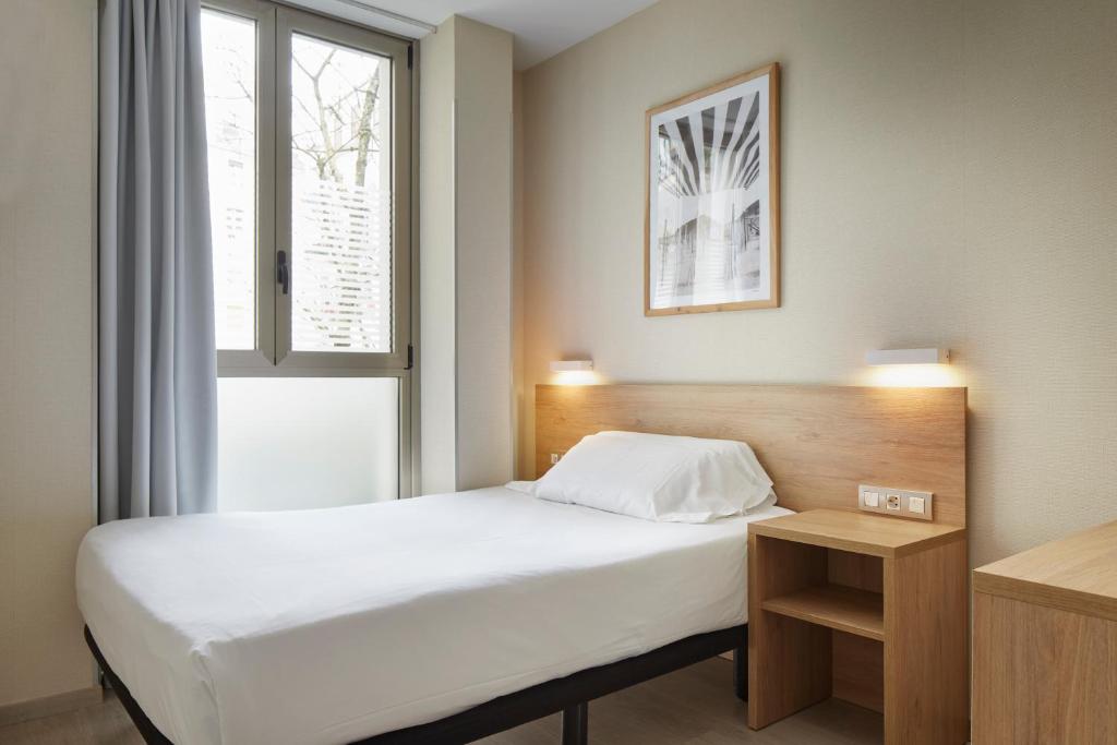 Postel nebo postele na pokoji v ubytování Welcome Gros Hotel
