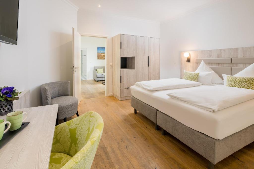Postel nebo postele na pokoji v ubytování Parkhotel Wangerooge