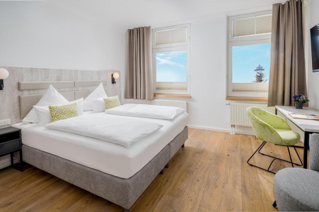 Postel nebo postele na pokoji v ubytování Parkhotel Wangerooge