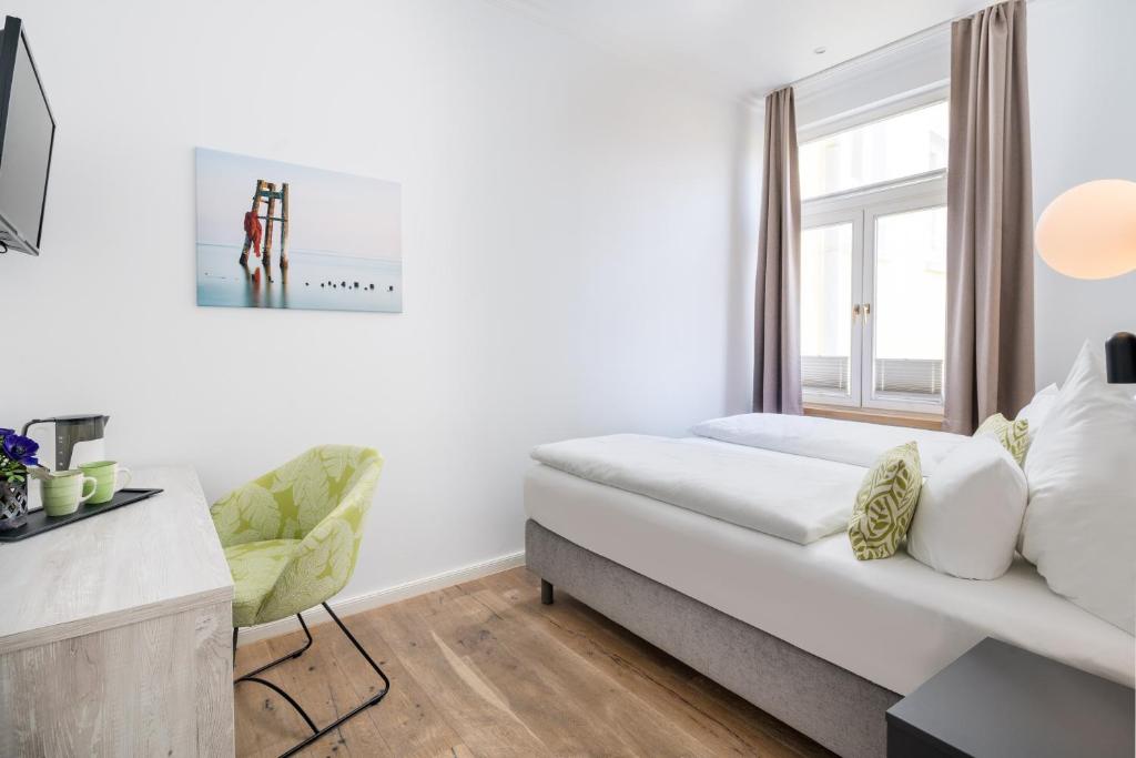 Postel nebo postele na pokoji v ubytování Parkhotel Wangerooge
