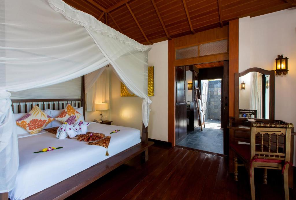 Postel nebo postele na pokoji v ubytování Elixir Resort Koh Yao Yai - SHA Plus
