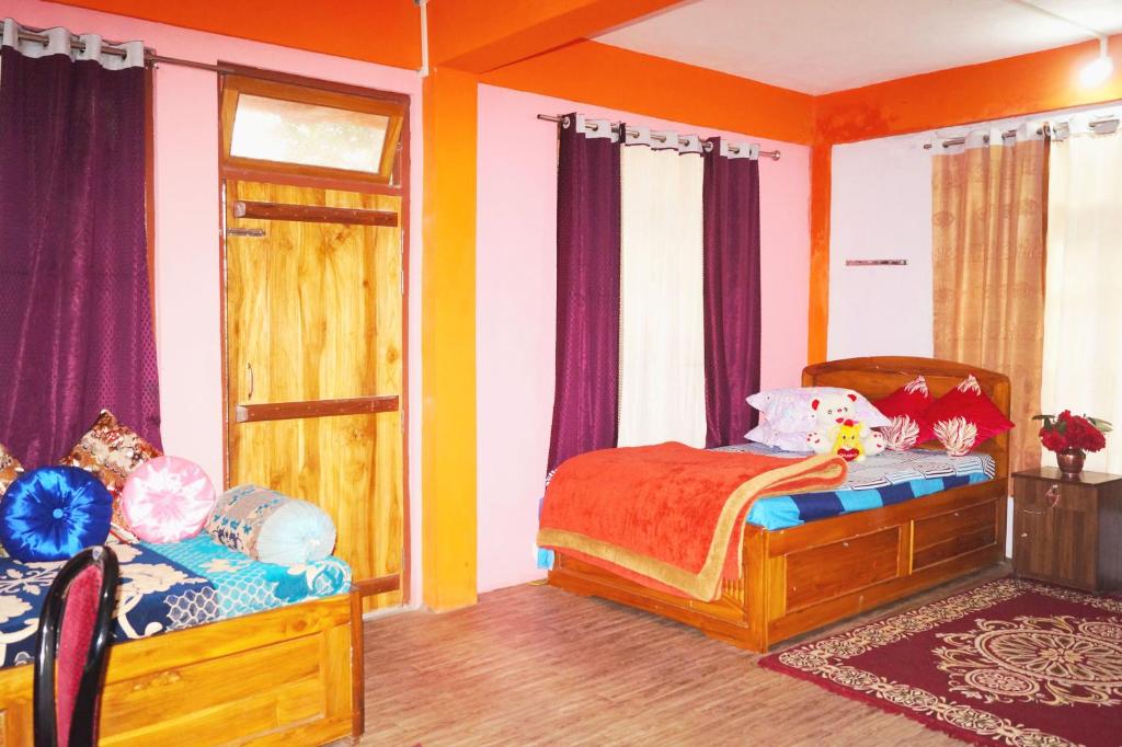 Postel nebo postele na pokoji v ubytování Yumasham Homestay