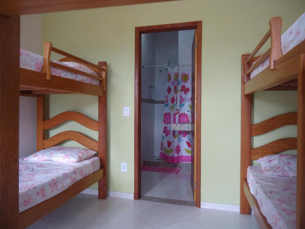 Postel nebo postele na pokoji v ubytování Harmoni Hostel & Pousada