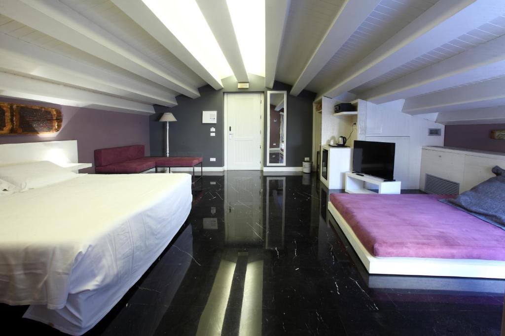 Postel nebo postele na pokoji v ubytování Quintocanto Hotel & Spa