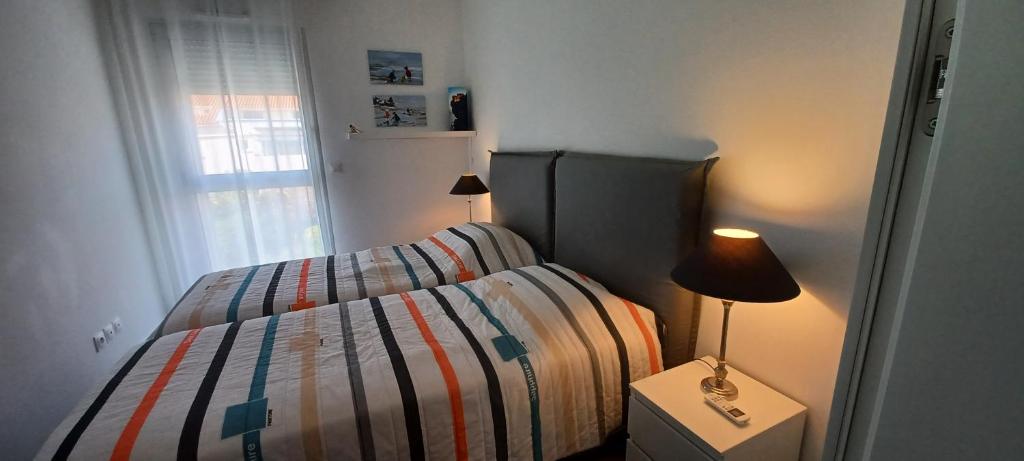 Posteľ alebo postele v izbe v ubytovaní NEPITA- Vue mer- piscine en résidence de standing- clim-Wifi