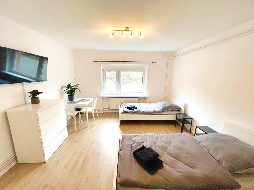 a bedroom with a bed and a desk in it at Modern Apartment in Schwarzenbek in Schwarzenbek