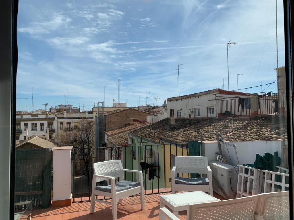 a balcony with chairs and a view of a city at Valencia Central Loft in Valencia