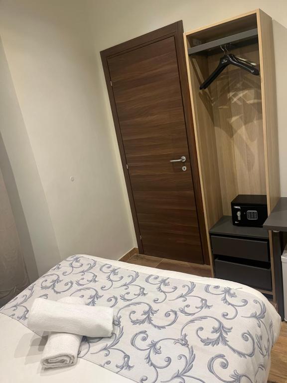 Postel nebo postele na pokoji v ubytování Hotel Veronese