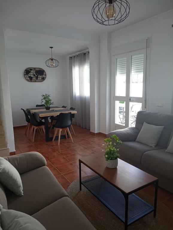 a living room with a couch and a table at Casa Cristy in Montejaque